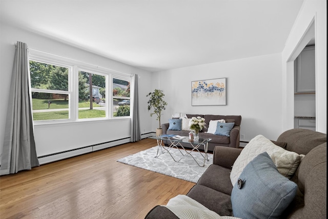 26 Helena Ave, Mohegan Lake, NY 10547 - living area featuring a baseboard heating unit, wood finished floors, and a baseboard radiator