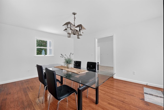 26 Helena Ave, Mohegan Lake, NY 10547 - dining area with a chandelier and wood finished floors