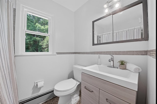 26 Helena Ave, Mohegan Lake, NY 10547 - full bath featuring a baseboard radiator, vanity, tile walls, a shower with curtain, and wainscoting