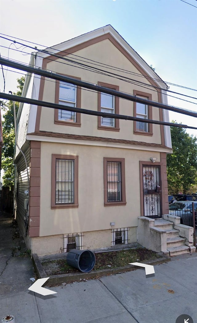 166-12 Douglas Ave, Saint Albans, NY 11433 - view of front of house featuring stucco siding