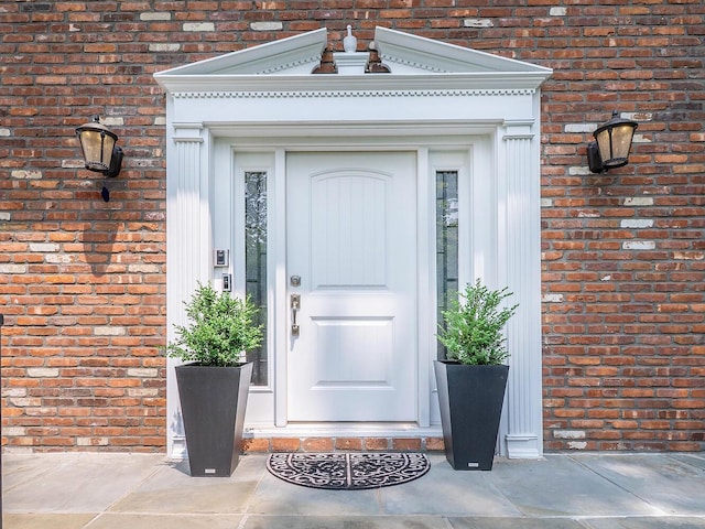 70 Scudders Ln, Roslyn Harbor, NY 11576 - doorway to property with brick siding