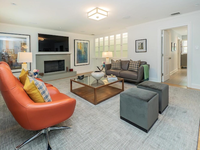 70 Scudders Ln, Roslyn Harbor, NY 11576 - living area with crown molding and a fireplace with raised hearth