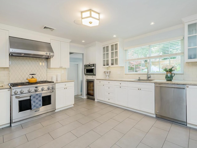 70 Scudders Ln, Roslyn Harbor, NY 11576 - kitchen featuring stainless steel appliances, wall chimney exhaust hood, beverage cooler, decorative backsplash, and ornamental molding