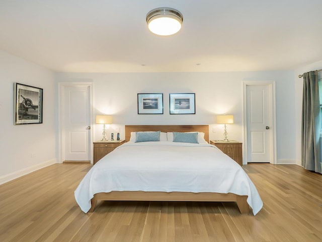 70 Scudders Ln, Roslyn Harbor, NY 11576 - bedroom featuring light wood-style floors and baseboards
