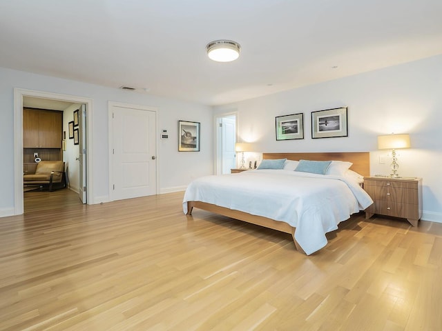 70 Scudders Ln, Roslyn Harbor, NY 11576 - bedroom featuring light wood-type flooring and baseboards
