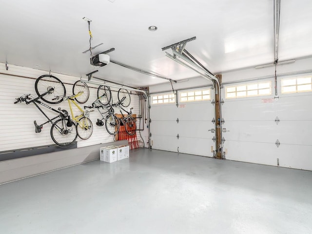 70 Scudders Ln, Roslyn Harbor, NY 11576 - garage featuring a garage door opener
