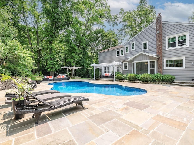 70 Scudders Ln, Roslyn Harbor, NY 11576 - outdoor pool with a pergola, a patio, and an outdoor living space