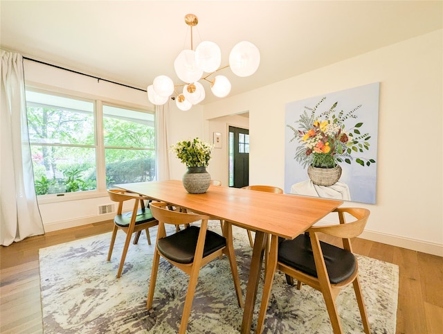 1 Concord Dr, Fort Salonga, NY 11768 - dining area with plenty of natural light, a chandelier, and light wood finished floors