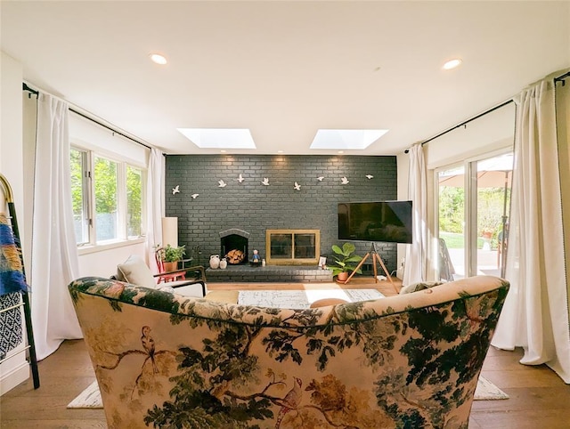 1 Concord Dr, Fort Salonga, NY 11768 - living room featuring a skylight, a fireplace, wood finished floors, and recessed lighting