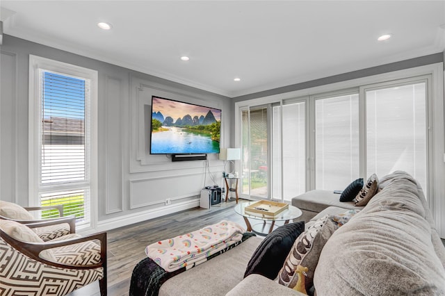 7 Wendell St, Plainview, NY 11803 - living room with a decorative wall, wood finished floors, healthy amount of natural light, ornamental molding, and recessed lighting