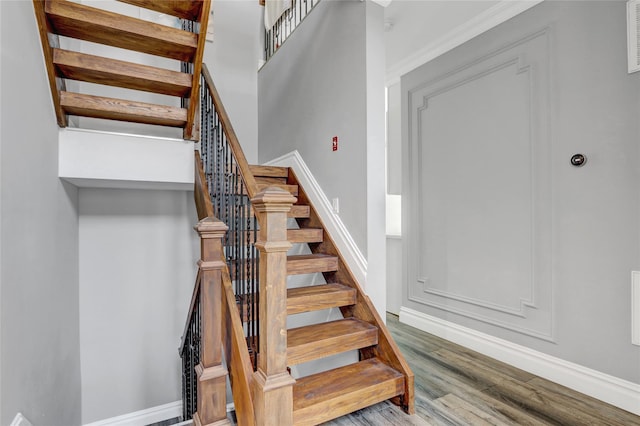 7 Wendell St, Plainview, NY 11803 - staircase featuring wood finished floors and baseboards