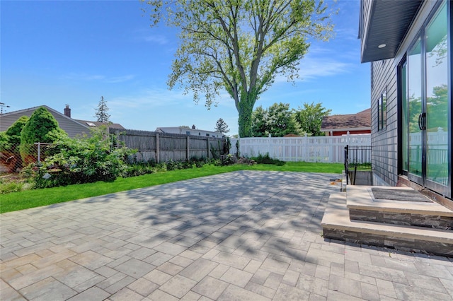 7 Wendell St, Plainview, NY 11803 - fenced backyard with a patio