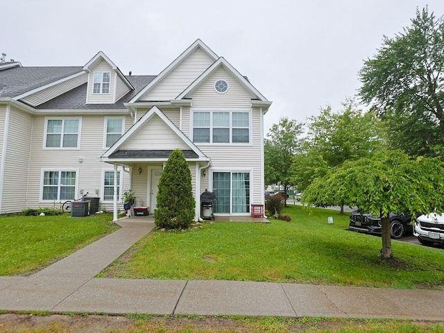 147 Ruth Ct, Middletown, NY 10940 - townhome / multi-family property with a front yard, central AC unit, and roof with shingles