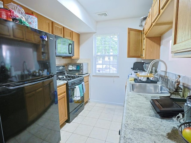 147 Ruth Ct, Middletown, NY 10940 - kitchen with black appliances, a sink, light countertops, light tile patterned flooring, and baseboards