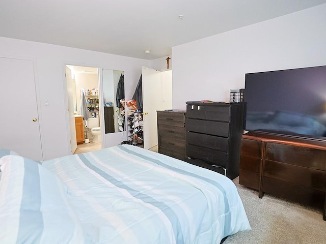 147 Ruth Ct, Middletown, NY 10940 - bedroom featuring connected bathroom and light colored carpet