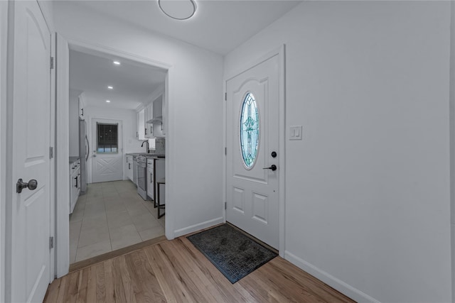 167 Front Ave, Brentwood, NY 11717 - foyer featuring light wood finished floors and recessed lighting