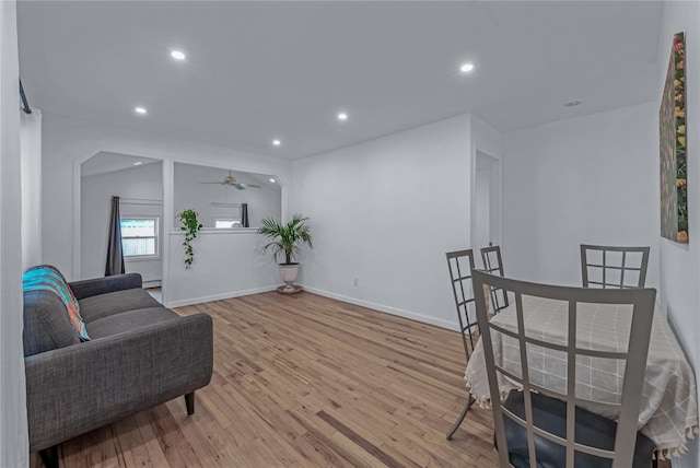 167 Front Ave, Brentwood, NY 11717 - living room featuring wood finished floors, recessed lighting, a ceiling fan, and a baseboard radiator