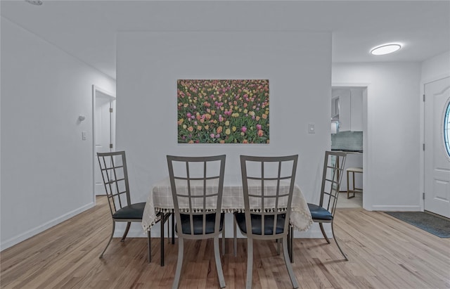 167 Front Ave, Brentwood, NY 11717 - dining area with wood finished floors and baseboards