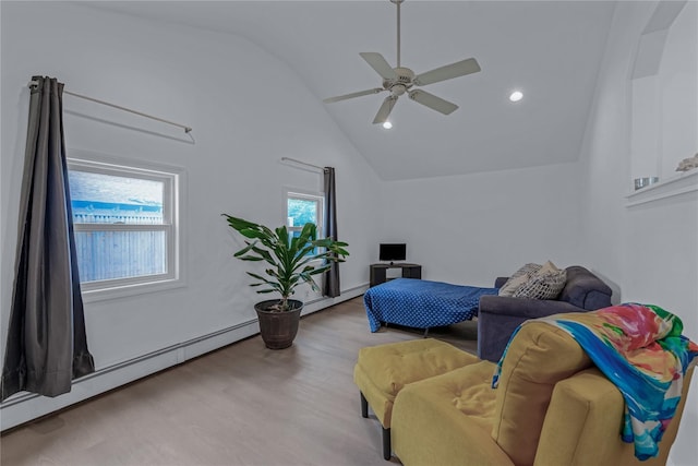 167 Front Ave, Brentwood, NY 11717 - living area with a baseboard radiator, wood finished floors, a ceiling fan, high vaulted ceiling, and recessed lighting