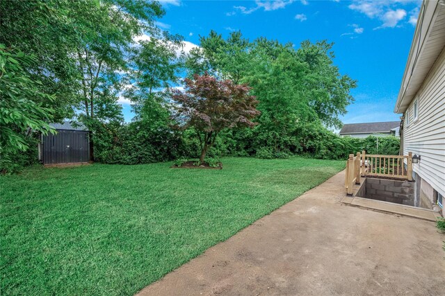 167 Front Ave, Brentwood, NY 11717 - view of grassy yard featuring a patio