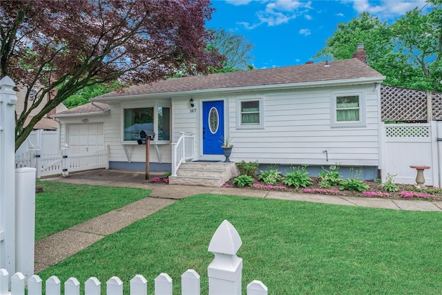 167 Front Ave, Brentwood, NY 11717 - view of front facade featuring a chimney, a gate, and a garage