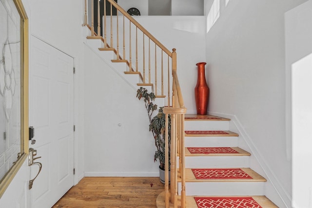 69 Plum St, Central Islip, NY 11722 - stairs with wood finished floors and baseboards