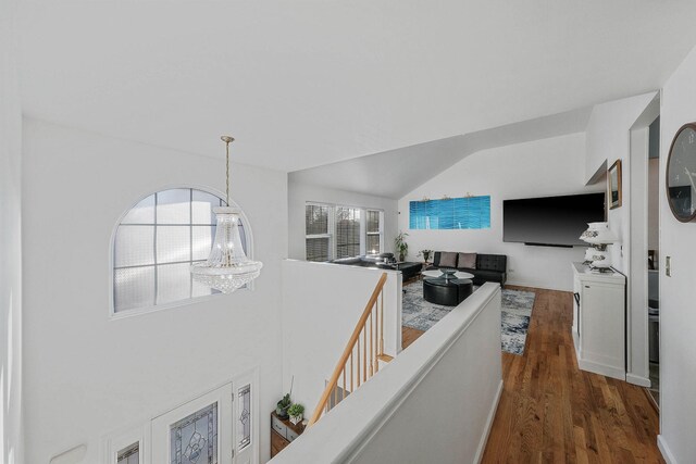69 Plum St, Central Islip, NY 11722 - hall featuring dark wood-style flooring, an upstairs landing, and lofted ceiling