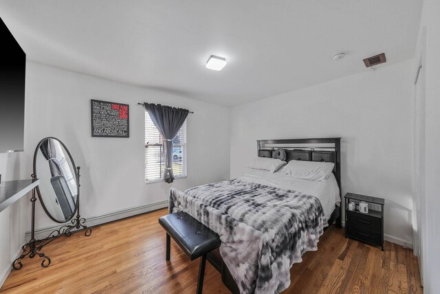 69 Plum St, Central Islip, NY 11722 - bedroom featuring wood finished floors and baseboards