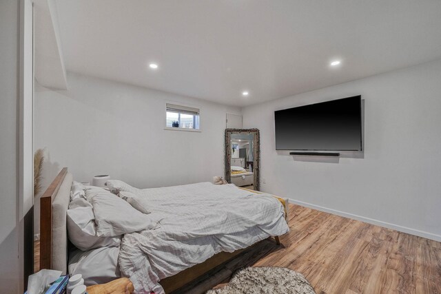 69 Plum St, Central Islip, NY 11722 - bedroom featuring recessed lighting, wood finished floors, and baseboards
