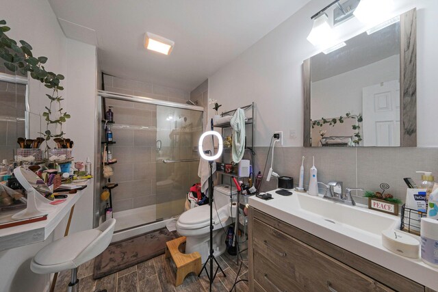 69 Plum St, Central Islip, NY 11722 - full bathroom with toilet, a stall shower, vanity, and wood finished floors