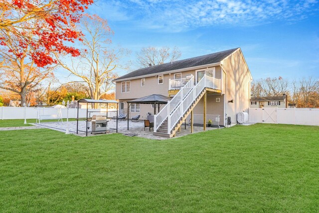 69 Plum St, Central Islip, NY 11722 - rear view of property featuring a gazebo, a patio area, a gate, and stairway