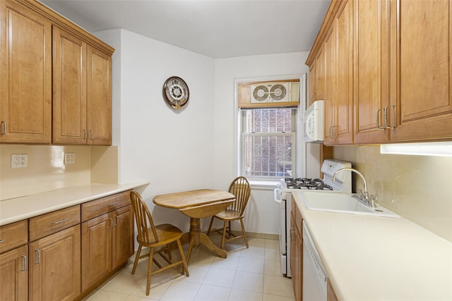 48-25 43rd St Unit 1J, Woodside, NY 11377 - kitchen with white appliances, a sink, brown cabinets, and light countertops