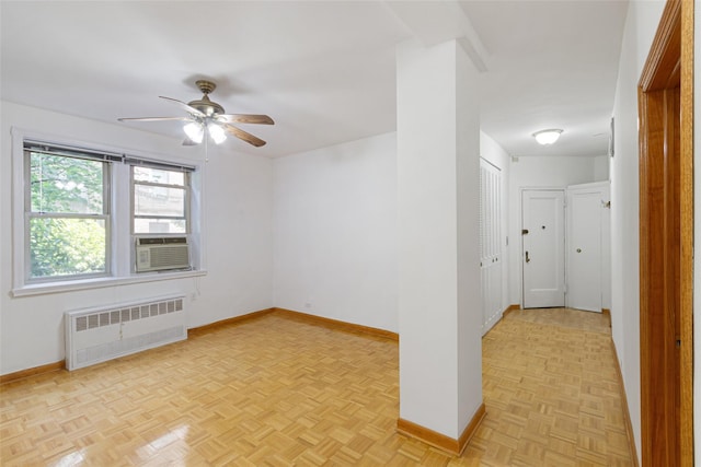 48-25 43rd St Unit 1J, Woodside, NY 11377 - empty room with radiator heating unit, baseboards, ceiling fan, and cooling unit