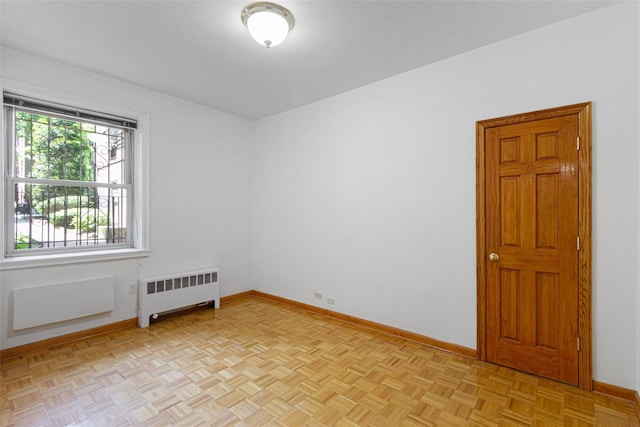 48-25 43rd St Unit 1J, Woodside, NY 11377 - spare room with radiator heating unit and baseboards