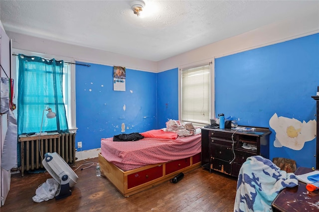 109 Leverich St, Hempstead, NY 11550 - bedroom with hardwood / wood-style floors, multiple windows, and radiator heating unit