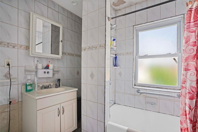 109 Leverich St, Hempstead, NY 11550 - bathroom with tile walls, vanity, healthy amount of natural light, and shower / bath combination with curtain