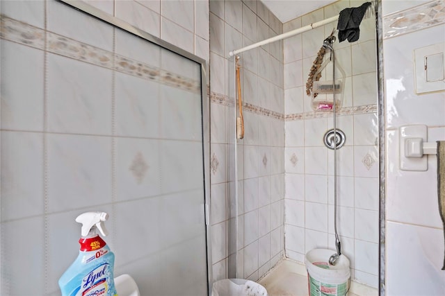 109 Leverich St, Hempstead, NY 11550 - full bath featuring tile walls and a stall shower