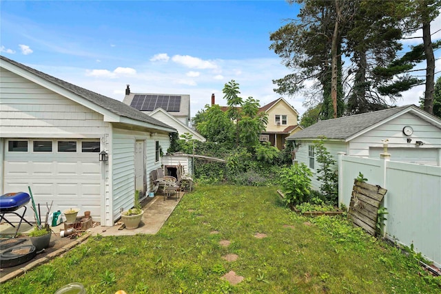 109 Leverich St, Hempstead, NY 11550 - view of yard with an outbuilding and a garage