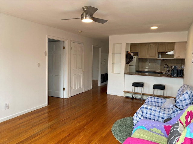42-31 Colden St Unit F6, Flushing, NY 11355 - living room featuring wood finished floors, baseboards, and a ceiling fan