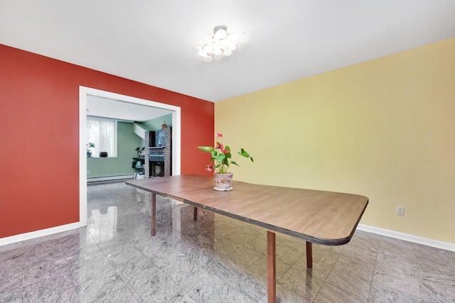 80-04 Cowles Ct, Middle Village, NY 11379 - dining space with baseboard heating and a fireplace