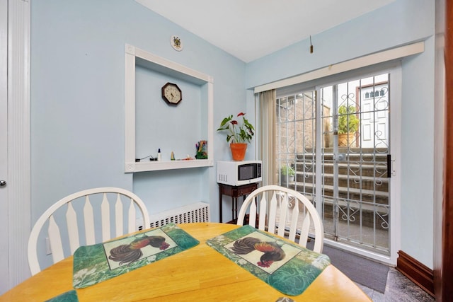 80-04 Cowles Ct, Middle Village, NY 11379 - dining area featuring carpet flooring and radiator
