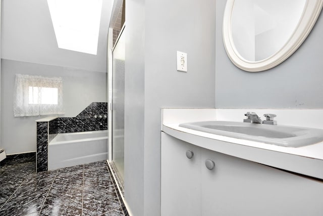 80-04 Cowles Ct, Middle Village, NY 11379 - full bathroom with a skylight, vanity, and a bath
