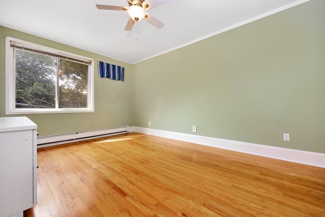 80-04 Cowles Ct, Middle Village, NY 11379 - spare room featuring a baseboard heating unit, light wood finished floors, a ceiling fan, and ornamental molding