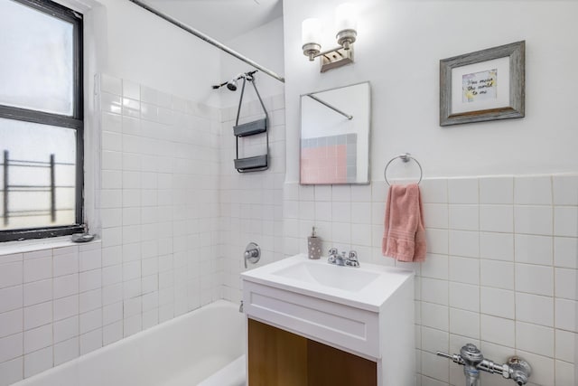 2420 Morris Ave Unit 5J, Bronx, NY 10468 - bathroom with tile walls, vanity, shower / washtub combination, and healthy amount of natural light