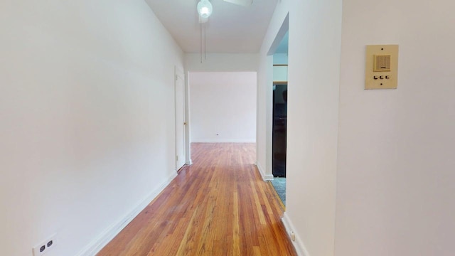 66-15 Wetherole St Unit E16, Rego Park, NY 11374 - hallway with light wood-style floors and baseboards