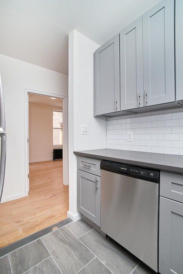 1069 Grant Ave, Bronx, NY 10456 - kitchen featuring dishwasher, gray cabinetry, and dark countertops