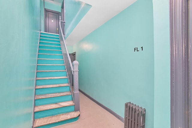 1069 Grant Ave, Bronx, NY 10456 - stairway featuring radiator and baseboards