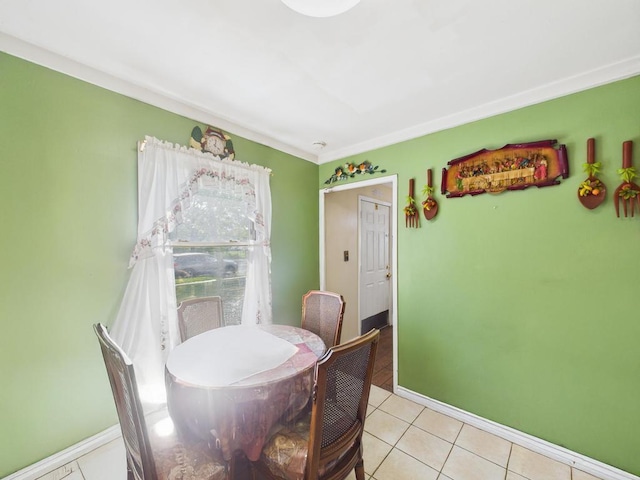 335 Loring Rd, Levittown, NY 11756 - dining space with light tile patterned floors and baseboards