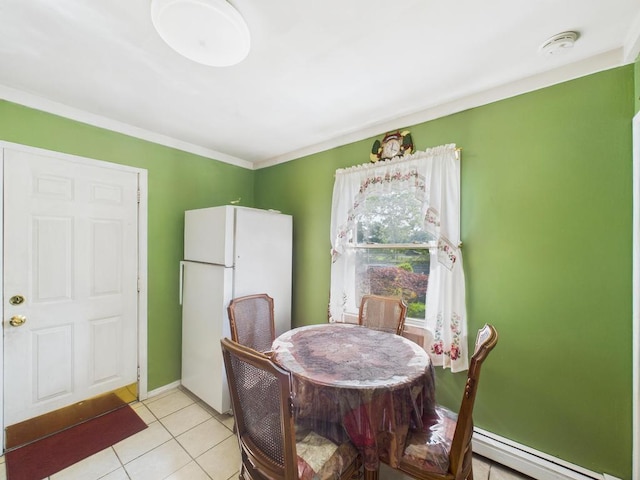 335 Loring Rd, Levittown, NY 11756 - dining room with a baseboard radiator and light tile patterned floors