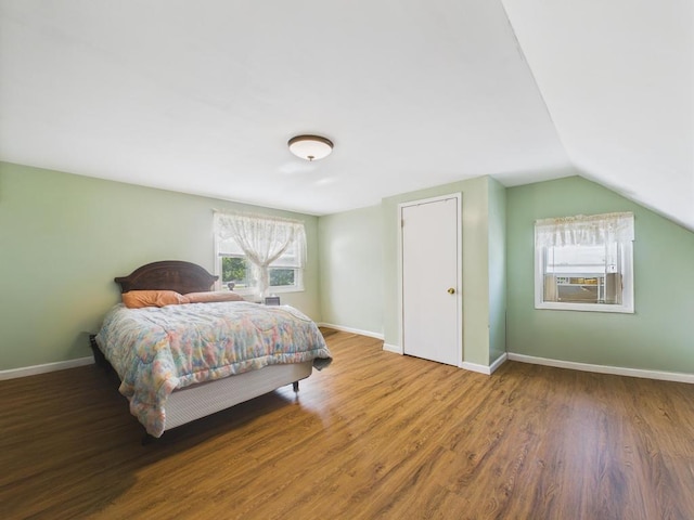 335 Loring Rd, Levittown, NY 11756 - bedroom with wood finished floors and vaulted ceiling